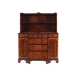 GEORGE III STYLE MAHOGANY WATERFALL BOOKCASE the superstructure with a series of open shelves; the