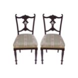 PAIR OF EDWARDIAN MAHOGANY OCCASIONAL CHAIRS each with a striped upholstered seat, raised on