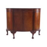 QUEEN ANNE STYLE WALNUT DRINKS CABINET the D-shaped top, above two central panelled doors, raised on