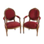 PAIR OF NINETEENTH-CENTURY LOUIS XVI STYLE GILT FRAMED ARMCHAIRS each with an oval upholstered