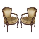 PAIR OF NINETEENTH-CENTURY LOUIS XV STYLE ELBOW CHAIRS each with an armorial shaped back and loose