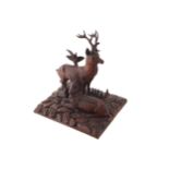 CARVED NINETEENTH-CENTURY BLACKFOREST SCULPTUREof two deer on a rocky mound28 cm. high; 28 cm. wide