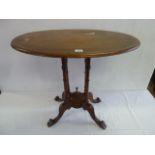 Victorian mahogany oval centre table together with a centre pedestal lion paw base table (later