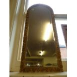Victorian gilt plaster arched bevel edge mirror