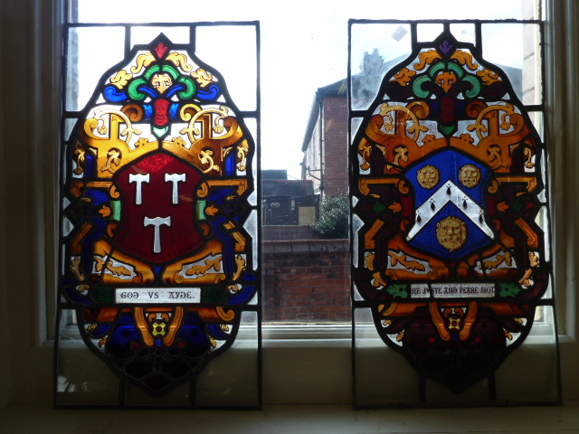 Pair possibly Victorian 17thC style stained glass panels featuring coat of arms of Ashby family and