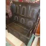 Carved oak high back settle