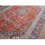 Red ground Persian Kashan traditional floral design carpet( approx 13' 2" x 9' 6")