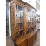 Burr walnut astragal-glazed break-front bookcase