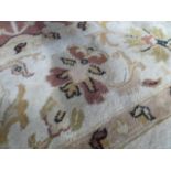 Beige ground woollen carpet 10 'x 6'6"