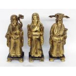 DREI CHINESISCHE WEISE / GELEHRTE China 3 große Figuren aus Holz, geschnitzt und vergoldet. Mit div.