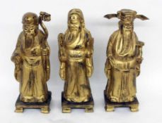 DREI CHINESISCHE WEISE / GELEHRTE China 3 große Figuren aus Holz, geschnitzt und vergoldet. Mit div.