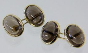 PAAR MANSCHETTENKNÖPFE 585/000 Gelbgold mit Rauchtopasen. Brutto ca. 11,7g A PAIR OF CUFF LINKS