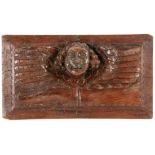 HOLZRELIEF MIT PUTTENKOPF 17./18.Jh. Geschnitztes Hartholz. 37x21cm A WOOD RELIEF WITH HEAD OF A