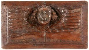 HOLZRELIEF MIT PUTTENKOPF 17./18.Jh. Geschnitztes Hartholz. 37x21cm A WOOD RELIEF WITH HEAD OF A