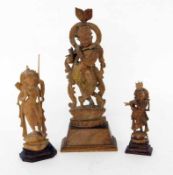 DREI GÖTTERFIGUREN Indien. Holz, geschnitzt. H. 16,5 - 31,5cm THREE FIGURES OF GODS India. Carved