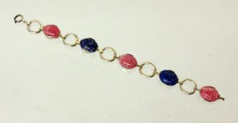 ARMBAND 830/000 Silber mit 5 Rhodochrosit- und Lapislazuli-Cabochons. L.19,5cm. Gest., Brutto ca.