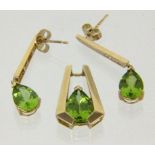 ANHÄNGER UND PAAR OHRSTECKER 585/000 Gelbgold mit Peridot und Diamanten. Brutto ca. 5,9g A PENDANT