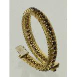 GRANTARMBAND750/000 Gelbgold mit Granatbesatz. L.18cm, Brutto ca. 33,74g Ein Stein fehlt.A GARNET