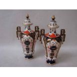 A pair of early 20th century Royal Crown Derby covered two handled vases, inverted baluster shape