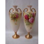 A pair of early 20th century Royal Worcester two handled vases, ovoid form with everted neck and