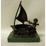 After Auguste Moreau, a 20th century bronze Figural Sculpture as a Putti in a small sailing boat,