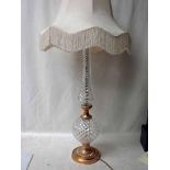 An impressive cut glass gilt metal Floor Lamp by Waterford, the light fitting and shade supported on