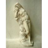 A 20th century Carrara marble Statuette as a female nude bending backwards against a rock in an