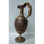 A 19th century cast brass and copper Pedestal Ewer, baluster form with caryatid handle as a naked