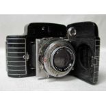 A Kodak Bantam Special Rangefinder Camera, black enamelled body with white metal stripes, serial