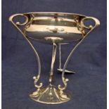 An early 20th century silver Bowl of compressed circular form with everted rim, set on integral