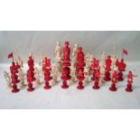 A late 19th century Chinese Canton set of carved natural and stained red ivory Chess Pieces as