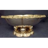 A large continental 800 silver Fruit Bowl, flower head circular form with cast foliate rim, on