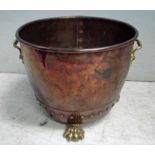 A Victorian riveted copper Firewood Bin, circular with a pair of brass rigid handles, supported on