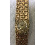 A Juvenia 18ct gold, ladies Swiss Wrist Watch with 18ct gold integral Pave Bracelet, gilt face