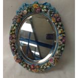 A late 19th/early 20th century Dresden style porcelain Easel Mirror, the oval turquoise beaded and