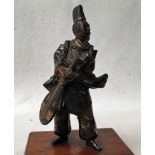 A Chinese small cast Bronze Figure of a musician holding a lute, gilt highlighting to his robes