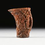 A CHINESE EROTIC CARVED WATER BUFFALO HORN CUP, the sides carved with five auspicious varieties of