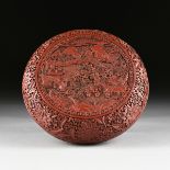 A CHINESE RED CINNABAR LACQUER LIDDED BOX, QIANLONG REIGN (1736-1795), the body of circular form,