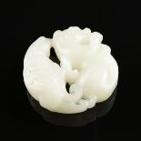 A CHINESE NEPHRITE JADE CARVING, MODERN, white to pale green stone with small black fleck