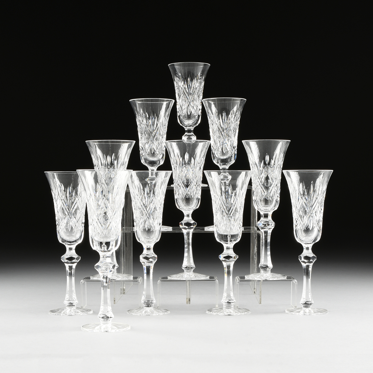 A SET OF ELEVEN WATERFORD CUT CRYSTAL CHAMPAGNE FLUTES IN THE "KILKEARY" PATTERN, IRELAND, CIRCA