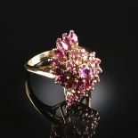 A 14K YELLOW GOLD AND RUBY LADY'S RING, prong set with one 3.5 millimeter round shaped ruby