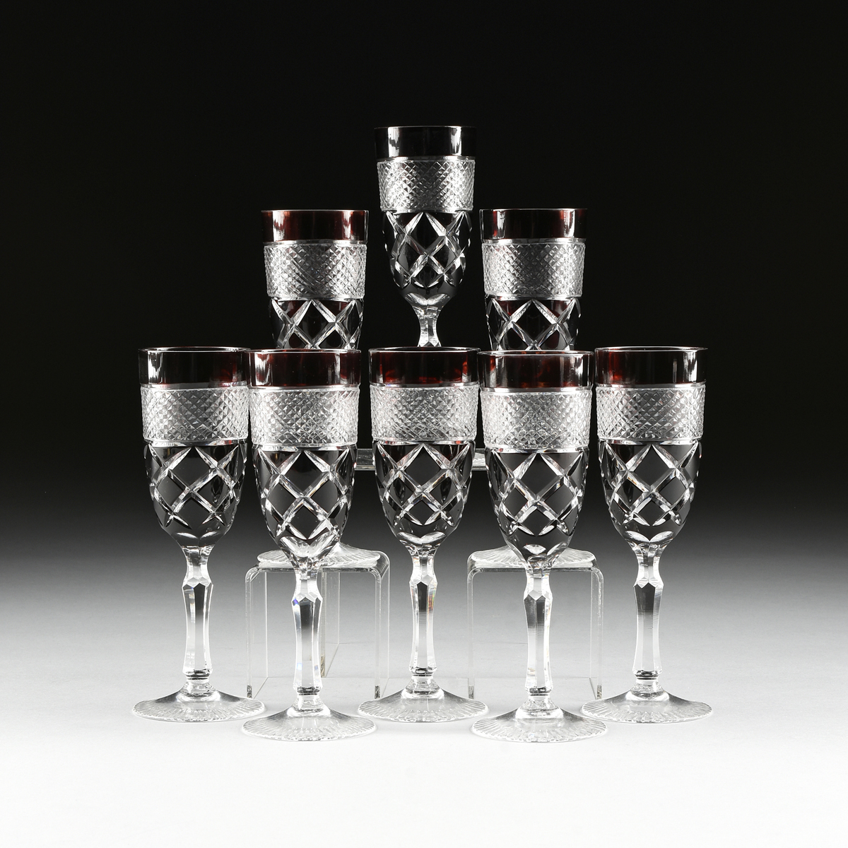 attributed to VAL ST. LAMBERT, A SET OF EIGHT RED DOUBLE CASED CUT TO CLEAR CRYSTAL CHAMPAGNE