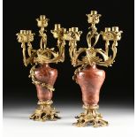 A PAIR OF LOUIS XV STYLE GILT METAL MOUNTED ROUGE MARBLE FIVE LIGHT CANDELABRA, CIRCA 1880-1900,