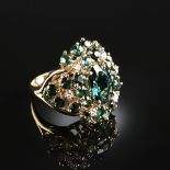 A 14K YELLOW GOLD, DIAMOND, GREEN EMERALD, AND GREEN TOURMALINE LADY'S RING, centering one oval