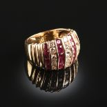 A 14K YELLOW GOLD, DIAMOND, AND RUBY LADY'S RING, set in alternating channel rows are fifteen