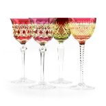 A GROUP OF FOUR CONTINENTAL CASED AND CUT GLASS WINE STEMS, CIRCA 1900-1920, comprising a