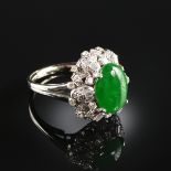 A PLATINUM JADEITE JADE AND DIAMOND LADY'S RING, with one jadeite jade measuring 9 x 12