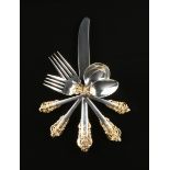 A ONE HUNDRED TWENTY-SEVEN PIECE SET OF WALLACE SILVERSMITHS GILT AND STERLING SILVER FLATWARE IN