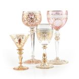 A GROUP OF FOUR BOHEMIAN GILT AND ENAMEL DECORATED WINE STEMS, CIRCA 1880-1900, comprising a cordial