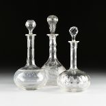 A GROUP OF THREE VICTORIAN CRYSTAL WINE DECANTERS WITH STOPPERS, ENGLISH, CIRCA 1850-1880,